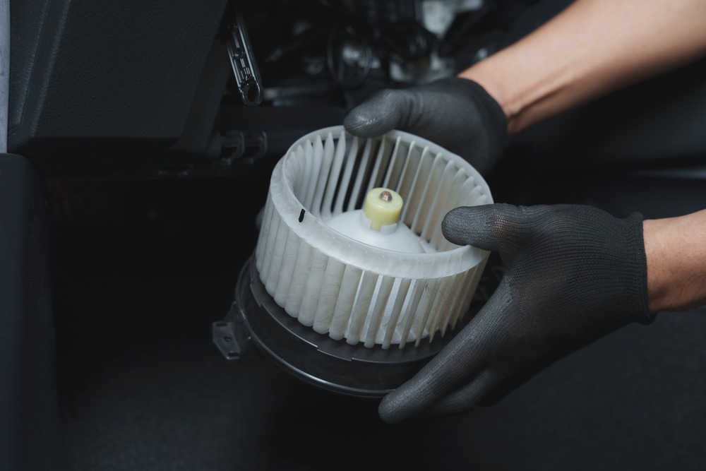 Close-up of an HVAC blower fan motor being replaced